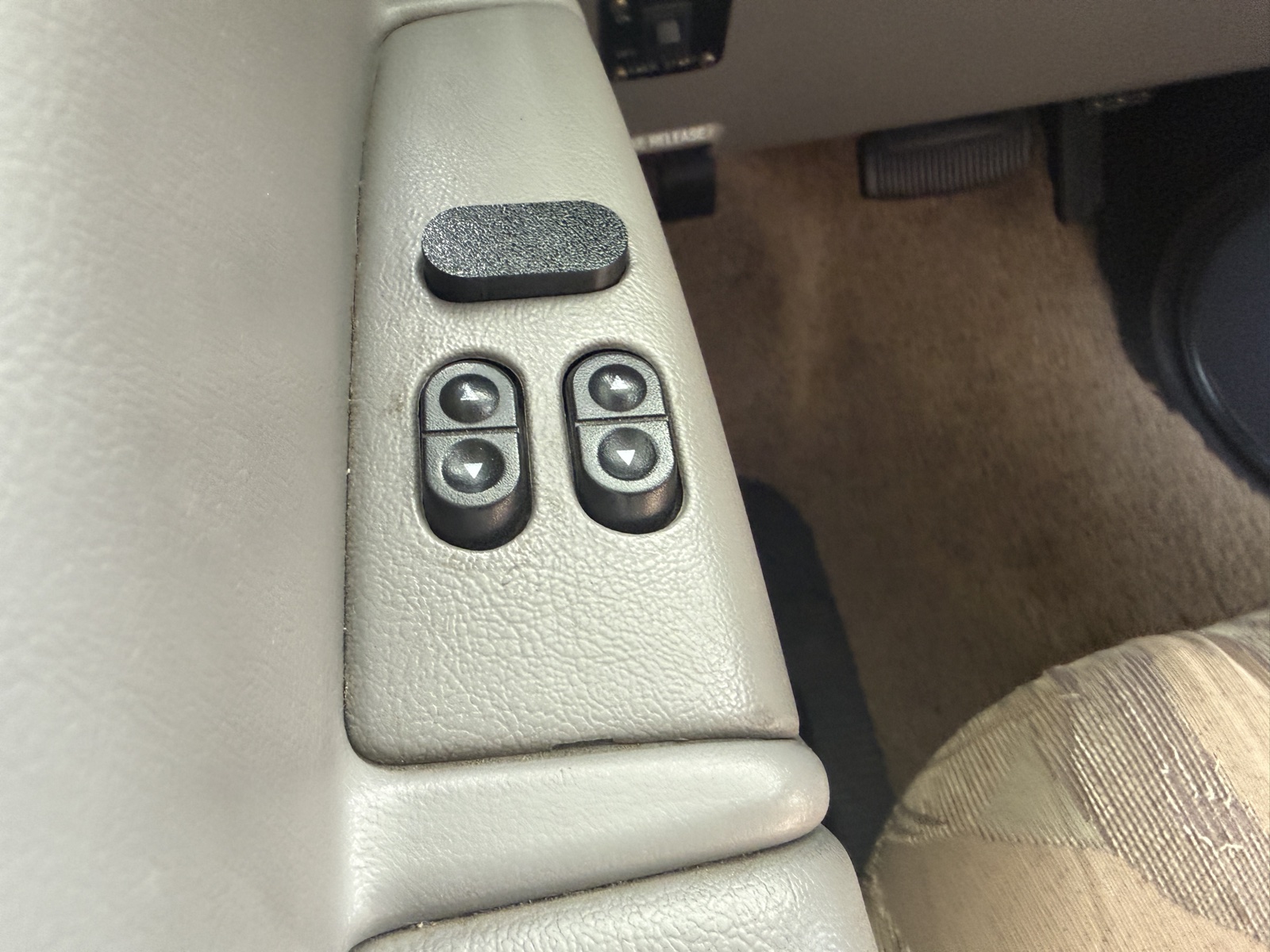 Single switch cover installed above the door window switches